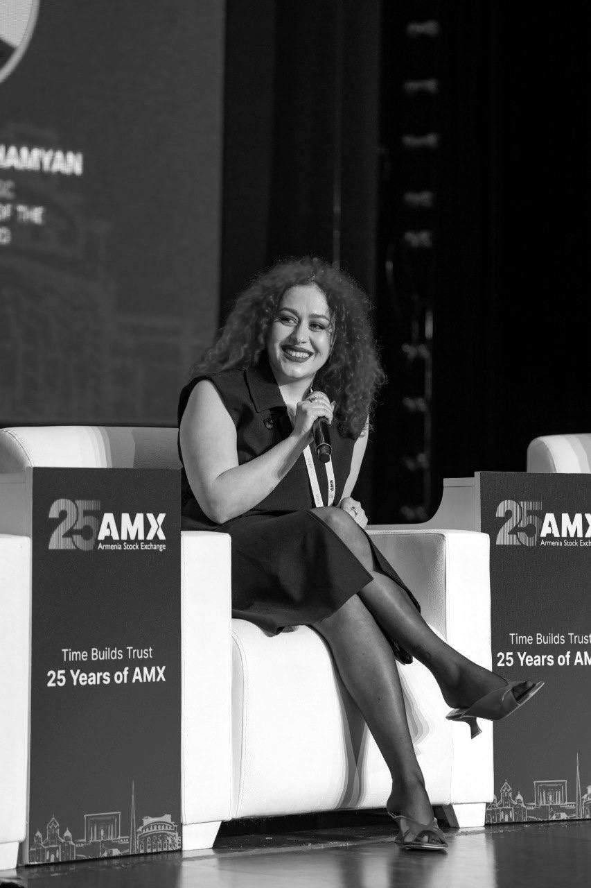 Metakse Ghambaryan speaking on the AMX 25th Anniversary Conference panel